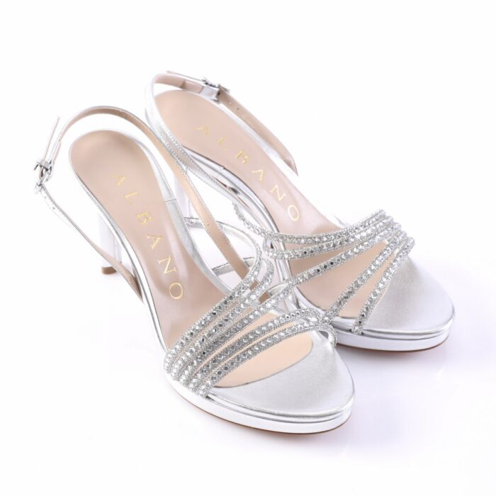 Silver strappy high-heeled sandals with rhinestone embellishments and open toes