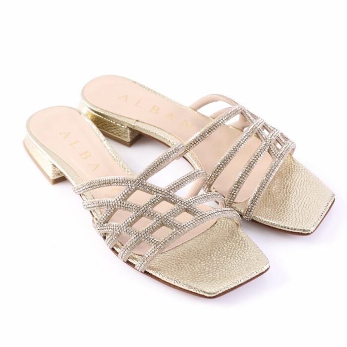 Gold, rhinestone-embellished, open-toe sandals with crisscross straps and low block heel.