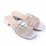 Silver metallic open-toe sandals with lattice glitter straps and low block heel.