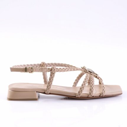Beige braided-strap sandals with a low block heel and ankle buckle.