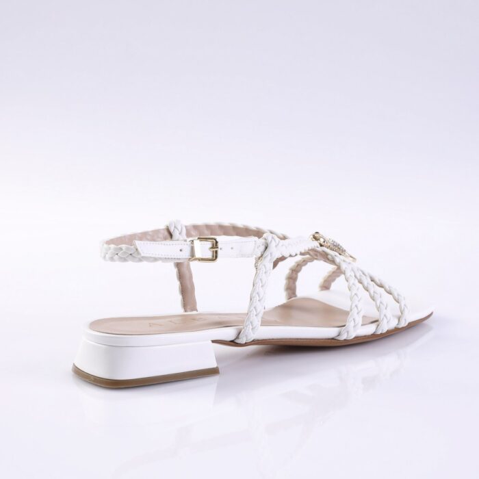 White braided-strap sandal with low block heel and ankle buckle, product photo.
