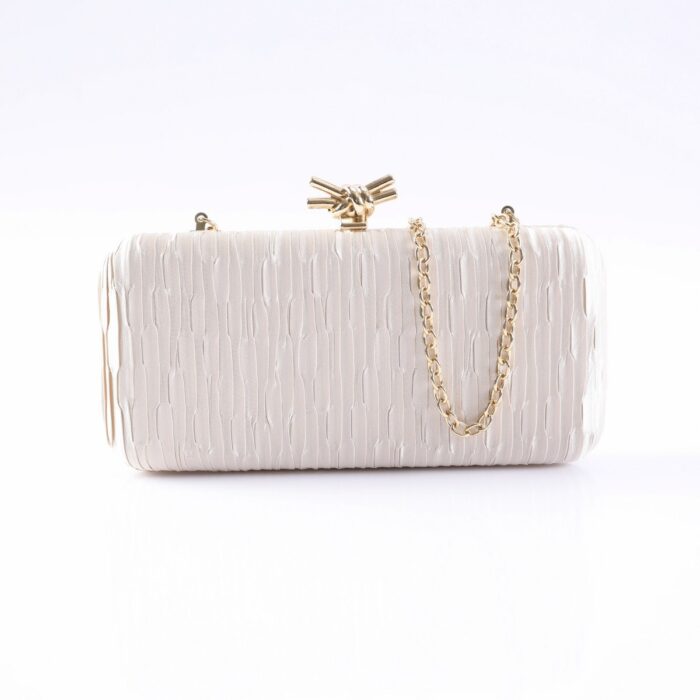 White textured clutch purse with a gold chain strap and knotted clasp on top