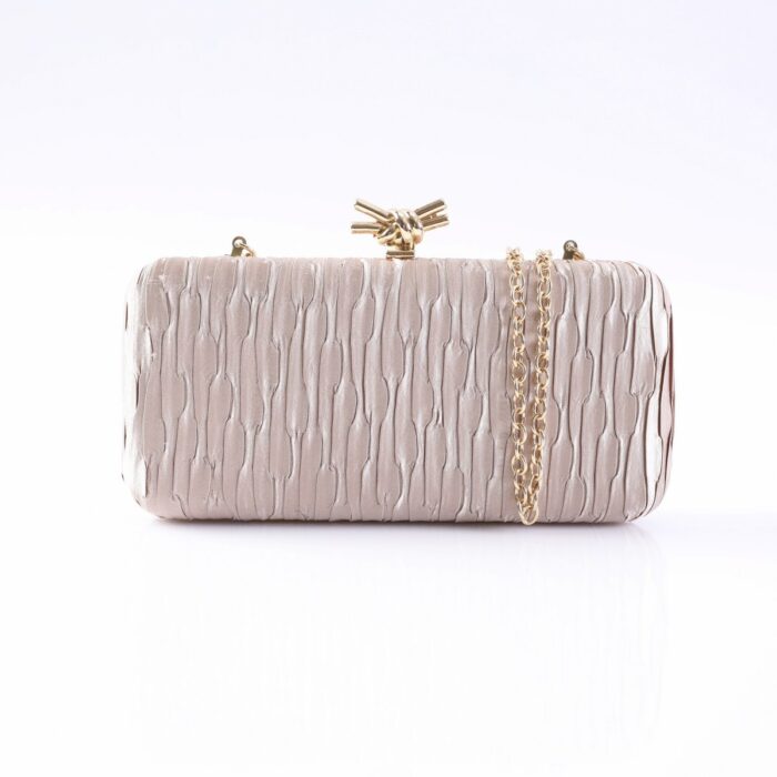Pink satin clutch with vertical pleats, gold-tone chain strap, and knotted clasp on top.