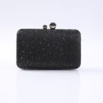 Black beaded clutch purse with a two-ball clasp, covered in small shiny beads.