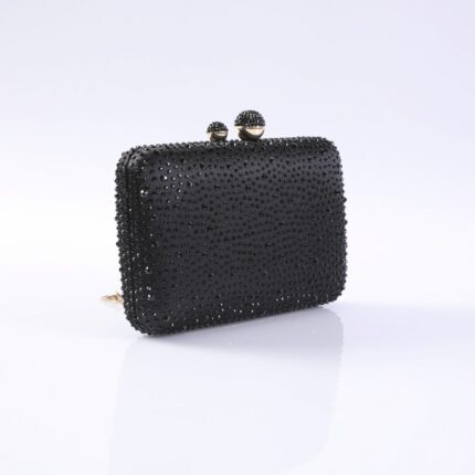 Black beaded clutch purse with a jeweled clasp on top, shown against a light background for evening wear.
