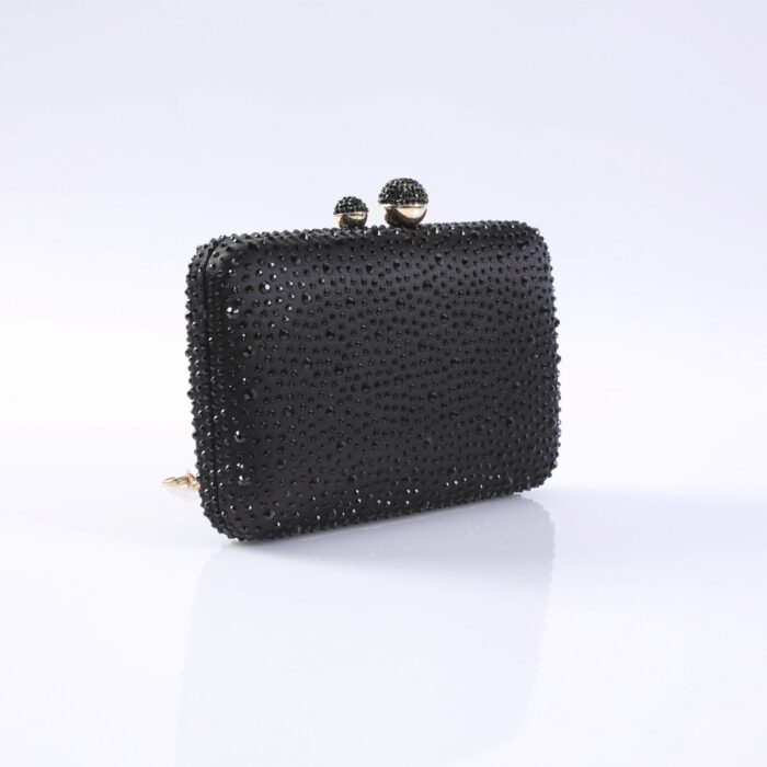 Black beaded clutch purse with a jeweled clasp on top, shown against a light background for evening wear.