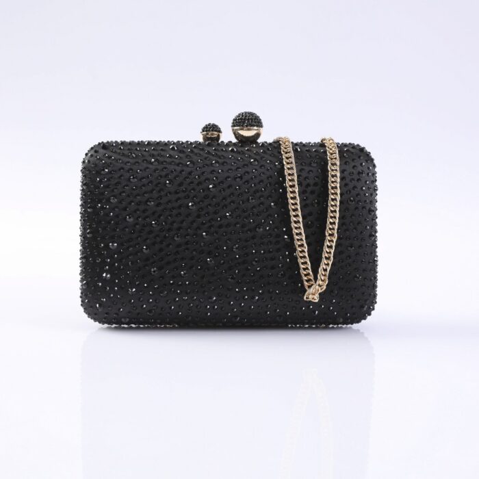 Black beaded evening clutch with a gold chain strap and rounded top clasp on a light background, front view.