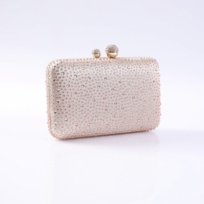 Beige clutch purse covered in small rhinestones with a two-ball clasp on top.
