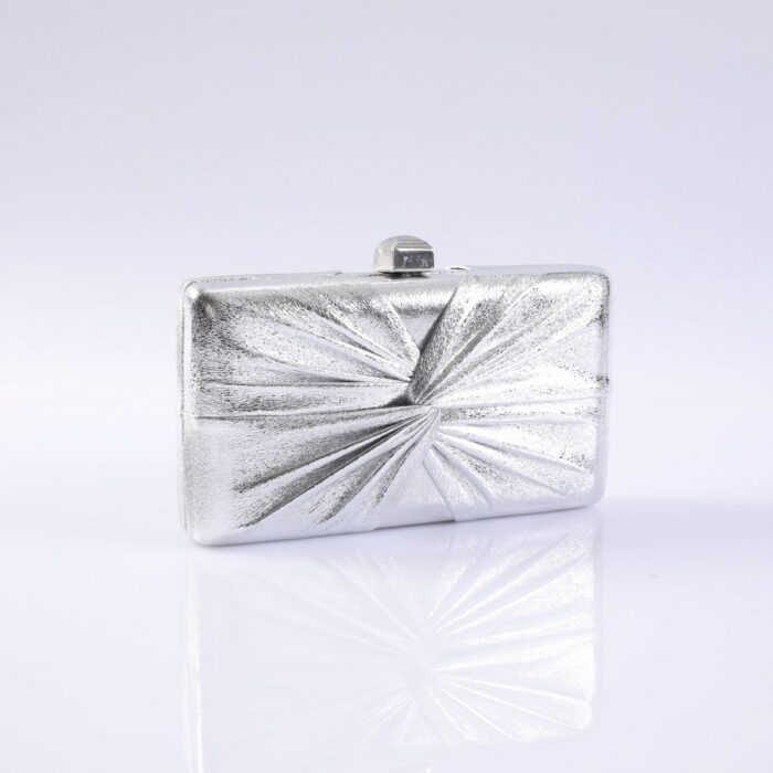 Silver rectangular clutch purse with a textured, starburst pattern and a small clasp on top.