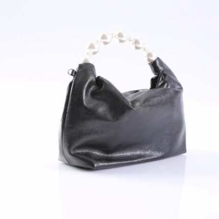 Small black leather handbag with a white pearl bead handle on a white surface.