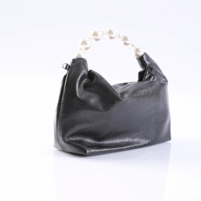 Small black leather handbag with a white pearl bead handle on a white surface.