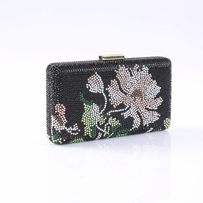 Black beaded clutch purse featuring a white-pink flower and green leaves, with a small gold clasp on top.