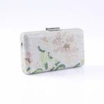 Silver rhinestone clutch bag with a metallic clasp and a pale floral pattern for evening wear