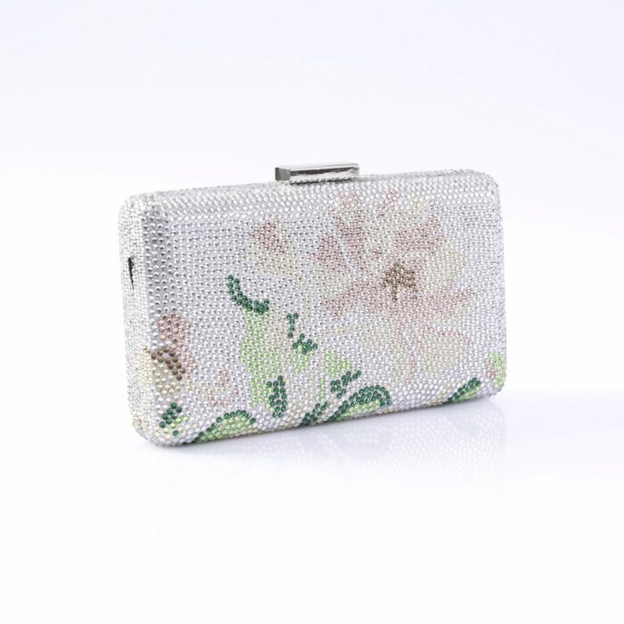 Silver rhinestone clutch bag with a metallic clasp and a pale floral pattern for evening wear