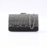 Beaded black-to-silver evening clutch with a silver chain handle and clasp on top