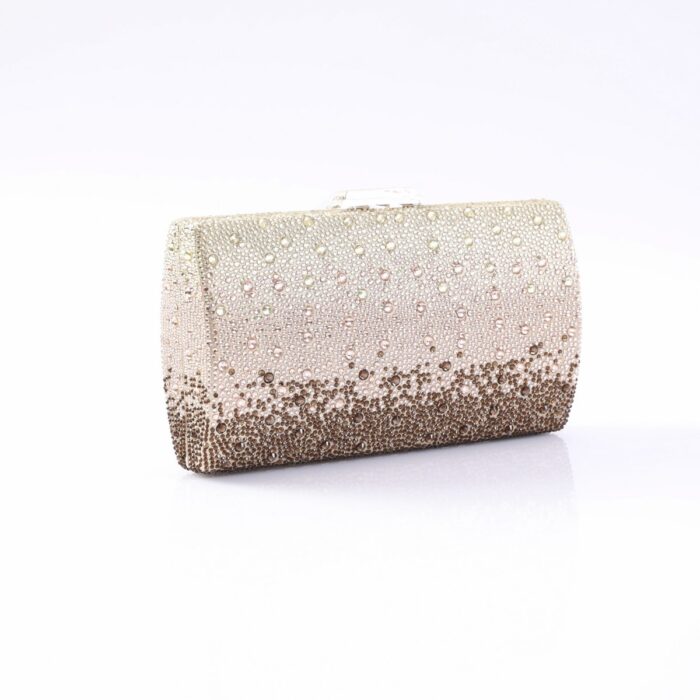 Sparkling gradient clutch purse covered in rhinestones from light champagne to bronze on a white surface.
