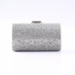 Silver rectangular clutch covered in small rhinestones with a metal clasp on top, for formal wear.