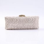 Cream lace clutch purse with a gold rectangular clasp on a white background.