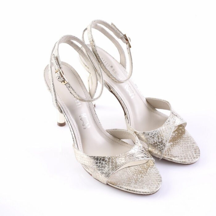 Silver metallic high-heeled sandals with open toes, ankle straps, and a slim ankle buckle (snakeskin texture).