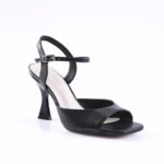 Black strappy open-toe high-heeled sandal with an adjustable ankle buckle on a white background.