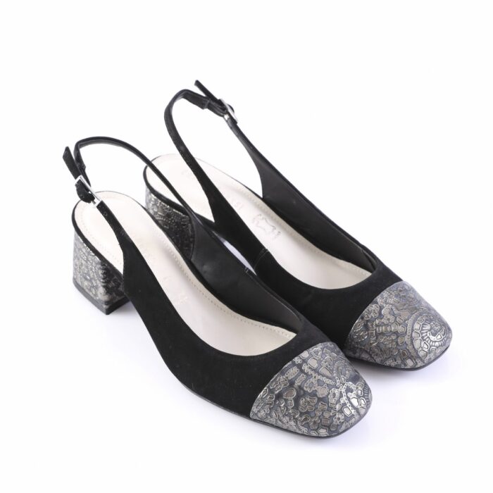 Black slingback pumps with metal-patterned silver toe caps and a low block heel on a white background, women’s dress shoes
