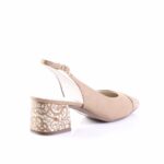 Beige suede slingback pump with a patterned block heel and open-toe design, shown from the side.