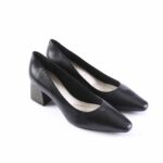 Black leather women's pumps with a pointed toe and a short striped block heel.09--note: the heel has horizontal stripes for a distinctive look.