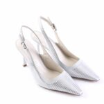 Silver metallic slingback pumps with pointed toes and diagonal stripes; medium-height heel and buckle strap for secure fit.