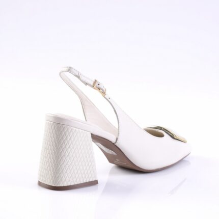 White slingback shoe with a textured block heel and gold buckle detail, shown from the side