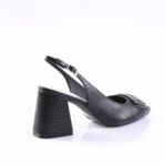 Black leather slingback pump with a textured, block heel and silver buckle strap over the vamp