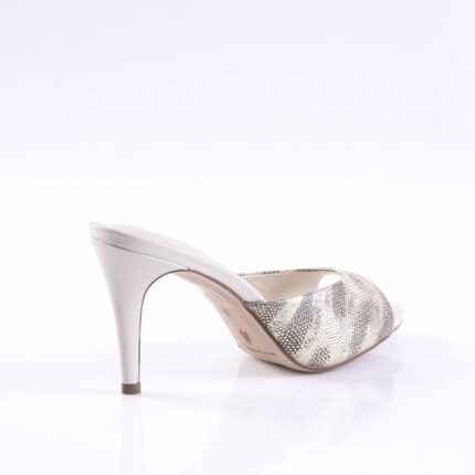 White high-heeled sandal with a snakeskin-pattern strap over the toe and an open back heel.