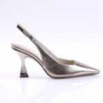 Metallic silver slingback pump with pointed toe and sculpted curved heel on a white backdrop