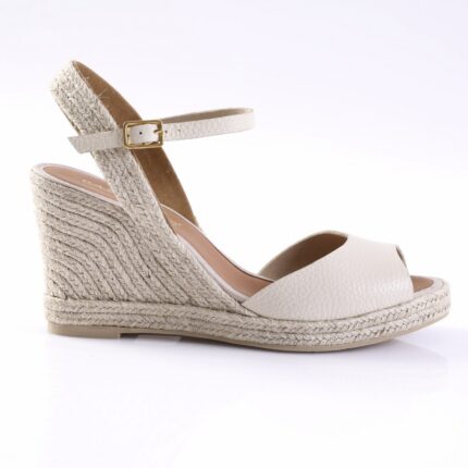 Cream espadrille wedge sandal with ankle strap and gold buckle on a white background.