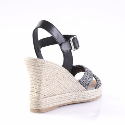 Black leather ankle-strap wedge sandal with braided front straps and a jute-wrapped platform heel