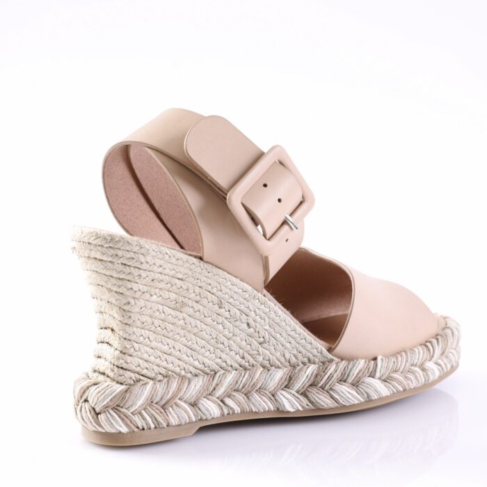 Beige espadrille wedge sandal with braided rope sole and wide ankle strap with square buckle.