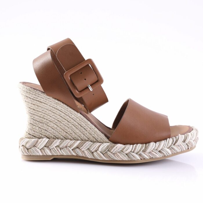 Brown leather wedge sandal with a wide front strap and ankle strap, on a braided rope-wrapped sole.