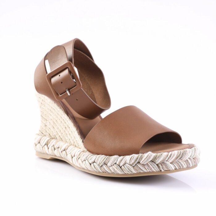 Brown leather wedge sandal with ankle strap and braided jute sole on white background, open toe design.