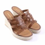 Brown leather wedge sandals with a braided jute espadrille sole.