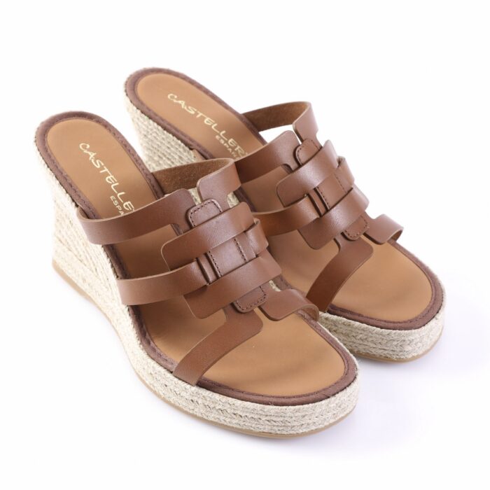 Brown leather wedge sandals with a braided jute espadrille sole.