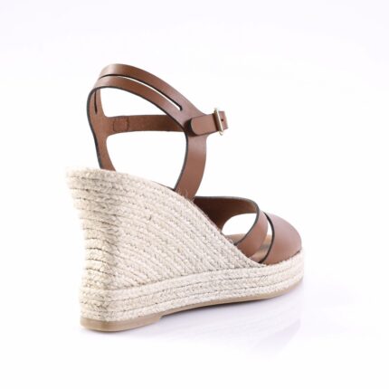 Brown leather espadrille wedge sandal with ankle strap and buckle, woven jute heel, viewed from rear-right side for profile.