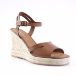 Brown leather wedge sandal with ankle strap and buckle, featuring a braided jute espadrille heel and open toe.