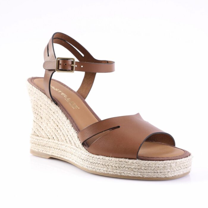 Brown leather wedge sandal with ankle strap and buckle, featuring a braided jute espadrille heel and open toe.
