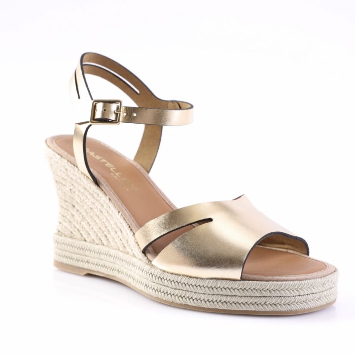 Gold metallic wedge sandal with ankle strap and braided jute sole by the heel area.