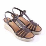 Black strappy wedge sandals with an ankle buckle and a natural braided-espadrille sole.