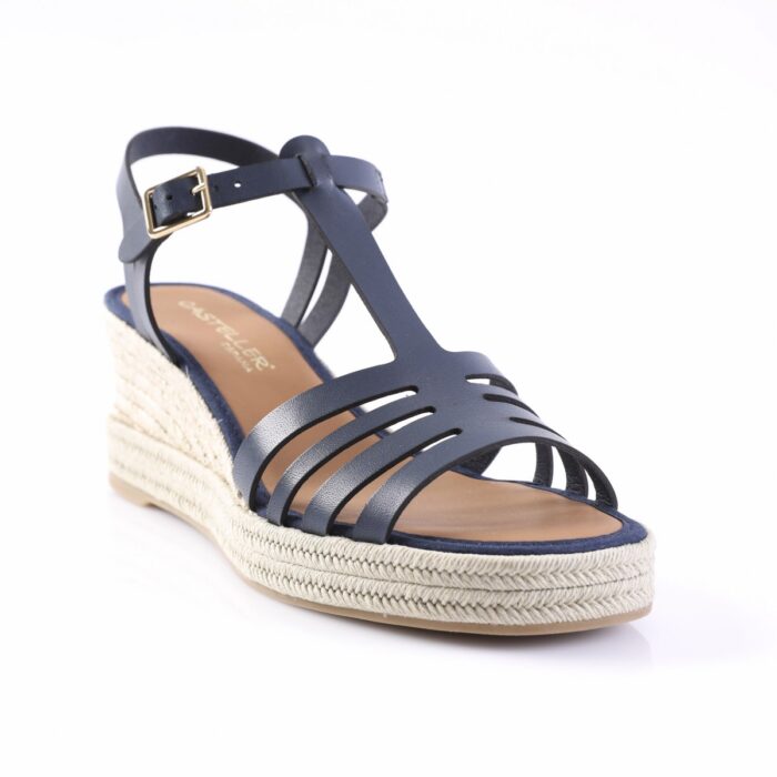 Navy blue strappy wedge sandal with a braided espadrille sole and gold buckle on the ankle strap.