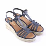 Navy blue wedge sandals with braided espadrille platform and ankle strap on white background