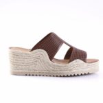 Brown slip-on wedge sandal with a braided jute sole and perforated upper.
