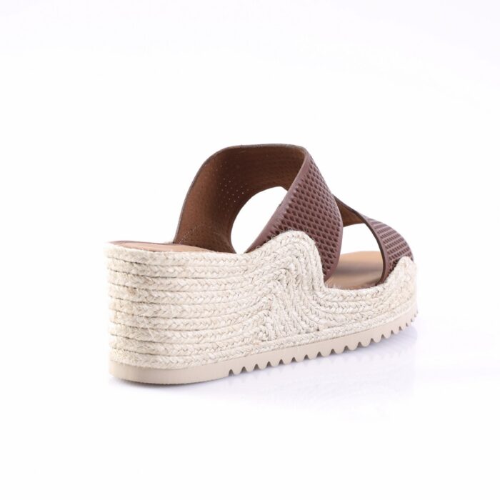 Brown leather slip-on sandal with a braided rope espadrille wedge and a textured strap, viewed from the back-right side