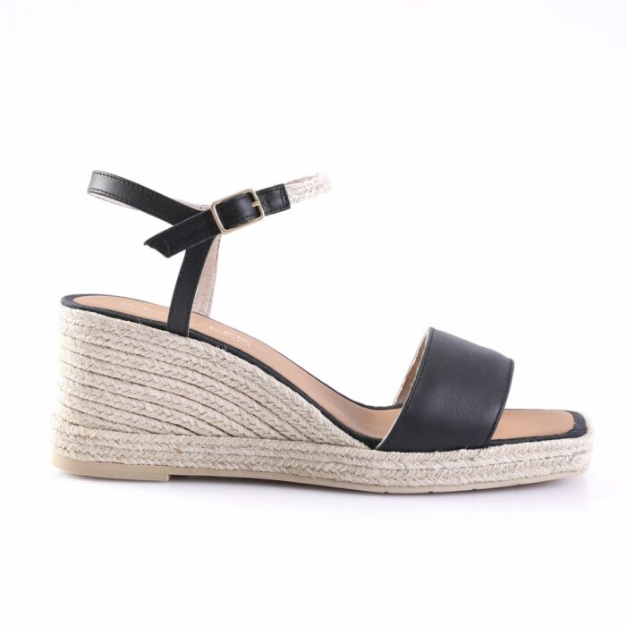 Black open-toe wedge sandal with ankle strap and buckle, featuring a woven rope espadrille sole (side view).