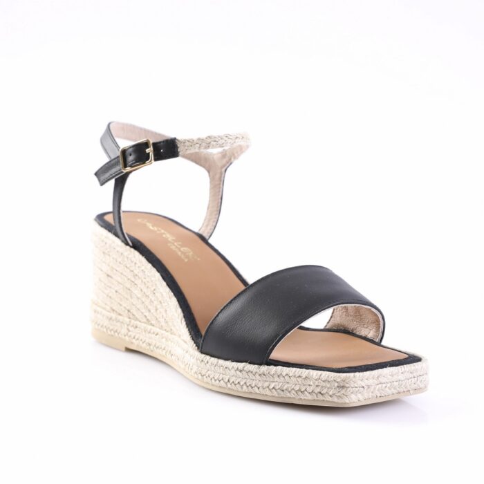 Black leather strap espadrille wedge sandal with ankle strap and gold buckle on a woven rope heel edge, open toe menage style.